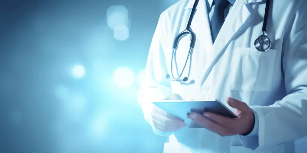 a doctor holding a tablet StratLeap | Healthcare