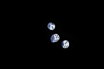 a hand throwing dice | StratLeap | Your Strategic Partner